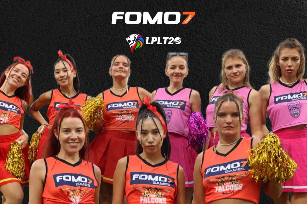 FOMO7 LPL cheer squad in pink and orange team outfits with league logo showing associate sponsor branding.